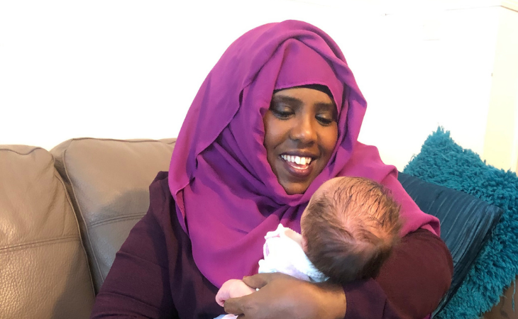 Foster Carer Amina holding baby