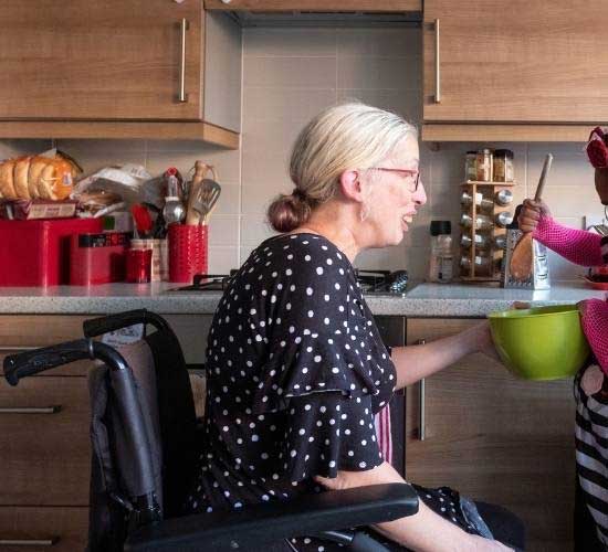 Foster carer Alison holding mixing bowl for young person